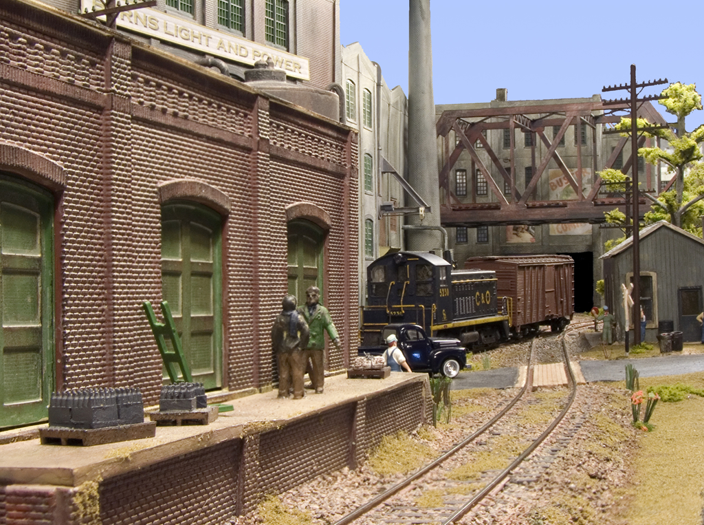 A view across the tracks from Jim's Printing with a C&O SW7 switching a box car in the distance.