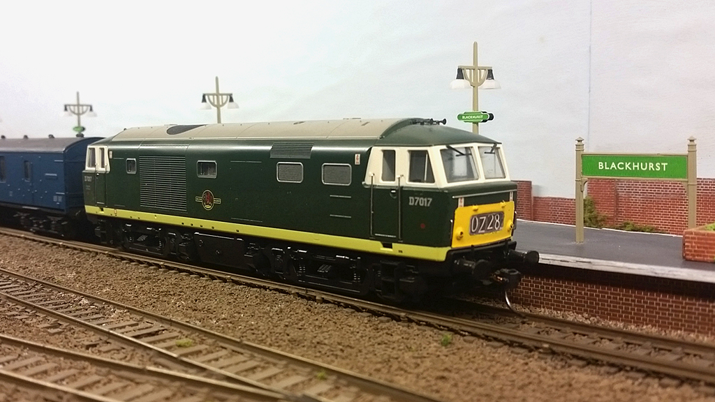 Hymek #D7017 waits to depart with a parcels train