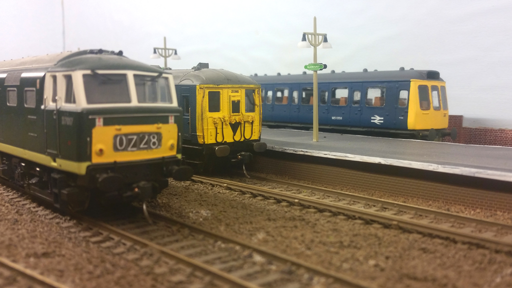 2-Bil #2046 and a Class 117 DMU wait to depart Blackhurst, whilst Hymek #D7017 sits on the loop.